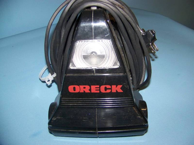 lot 21 image: Small, Handheld Oreck Vacuum