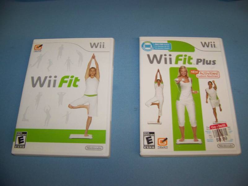 lot 57 image: Nintendo Wii, Fit Games and Exercise Board