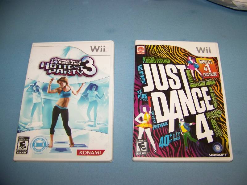 lot 58 image: Nintendo Wii, Just Dance Games and Dance Pad