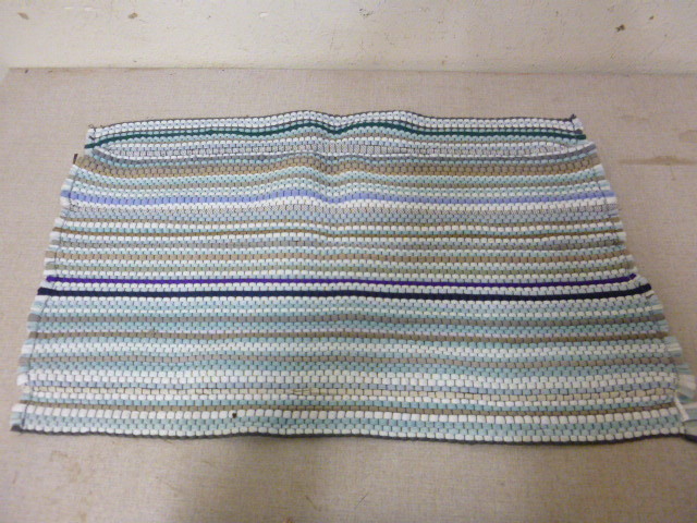 lot 107 image: Woven Rug
