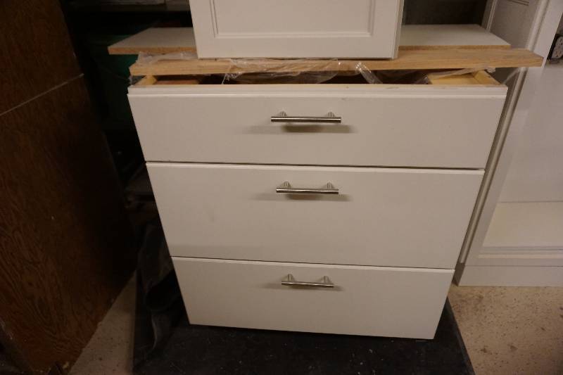 lot 57 image: 3 pc White Wood Finish Bathroom Cabinetry