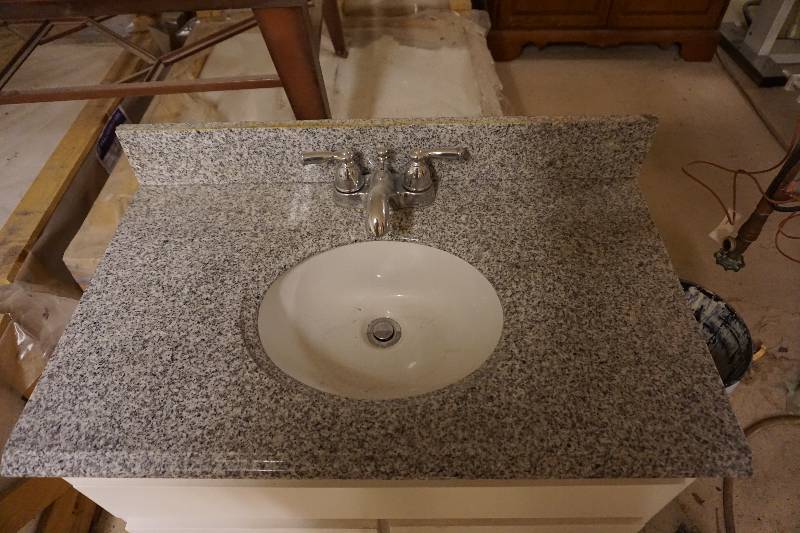 lot 56 image: Bathroom Vanity Cabinet With Marble Sink Top and Splash Board