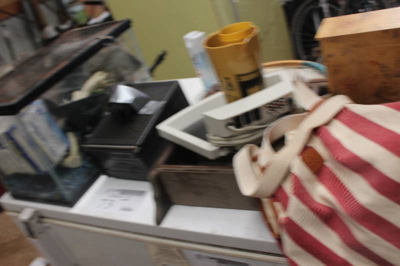 lot 73 image: Contents on Top of Freezer Including Aquarium Tennis Rackets TV Wood Shelf And More