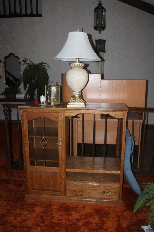 lot 235 image: Entertainment Center w Contents Including Clock Lamp