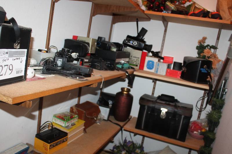 lot 279 image: 2-Shelf Contents Including Decorations Camera Equipment and Cases Music Books
