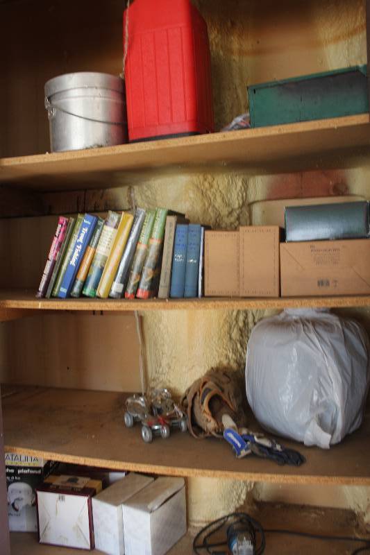 lot 315 image: Contents Including Vintage Steel Wheel Skates Baseball Gloves  Books Light Fixtures And More