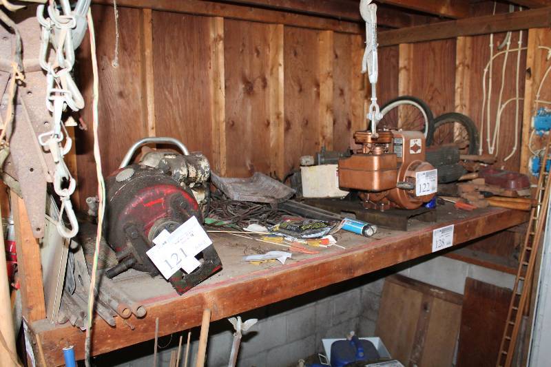 lot 128 image: Contents of Shelves Including Motors Tools Hardware Wood Spindles Wheelbarrow Wheels Bicycle Wheels Radiator Mailbox And More