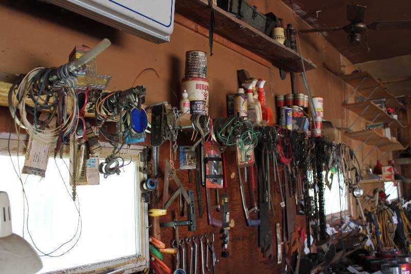 lot 156 image: Contents On and Hanging From Including 2-Cycle Engine Oil Household Cleaners Lighting Wiring Tools Car Parts