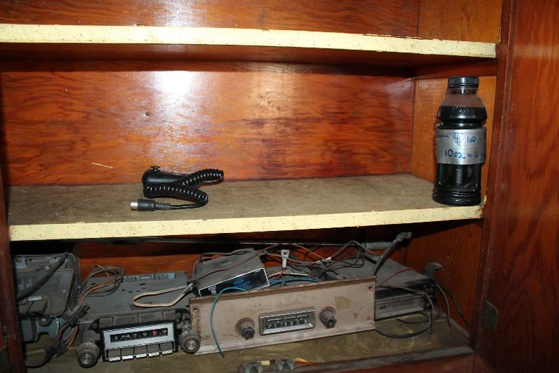 lot 132 image: Contents of Cupboard Including Car Stereos CB Mic Insecticides Solar Path Lights Lawn Sprinklers Plastic Pipes