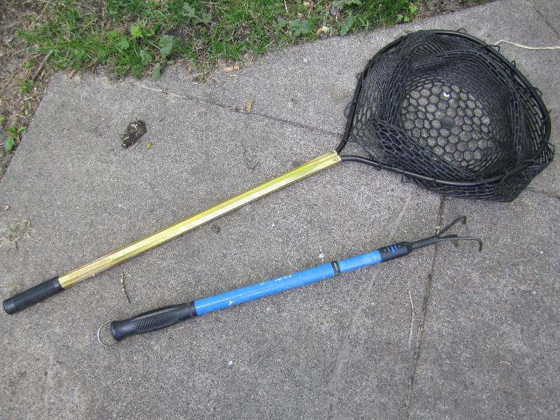 lot 148 image: Fish net and adjustible length fork...