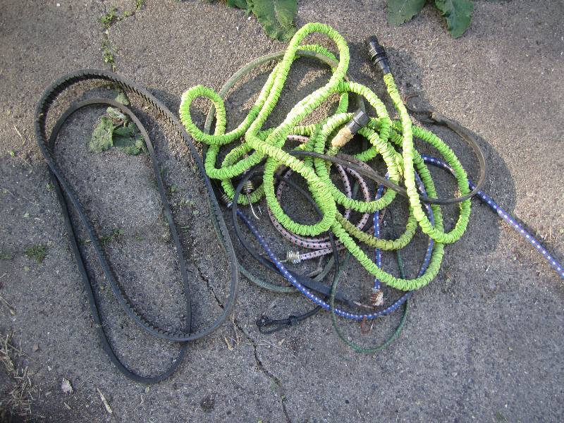 lot 164 image: Bungee cords, hose and belts...