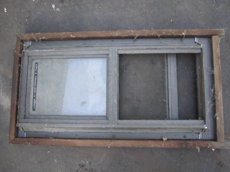 lot 188 image: Older sliding window in frame...