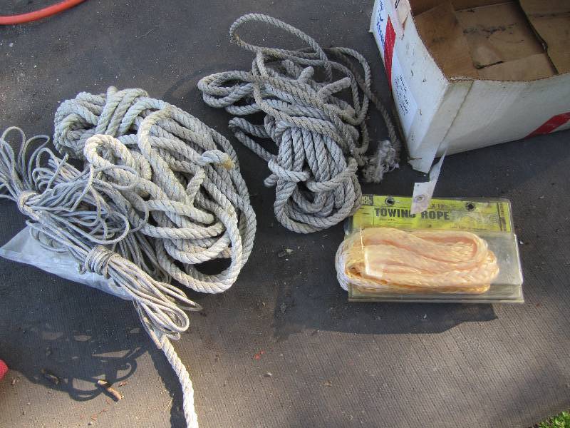 lot 215 image: Lot of rope and a new tow strap...