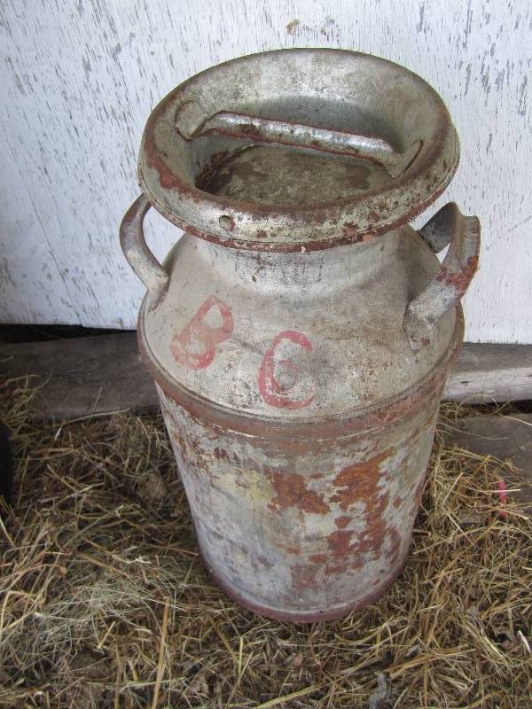 lot 409 image: Milk can with lid...