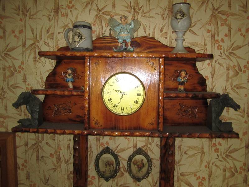 lot 24 image: Wood wall clock display with conten...