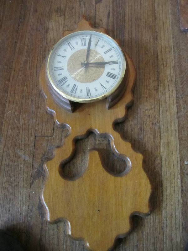 lot 47 image: Wood wall clock display with conten...