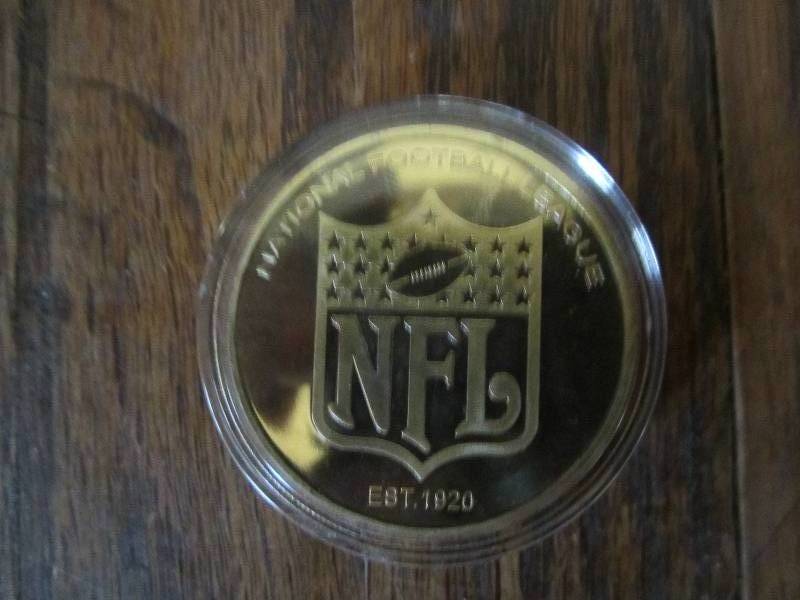 lot 67 image: Minnesota Vikings coin...