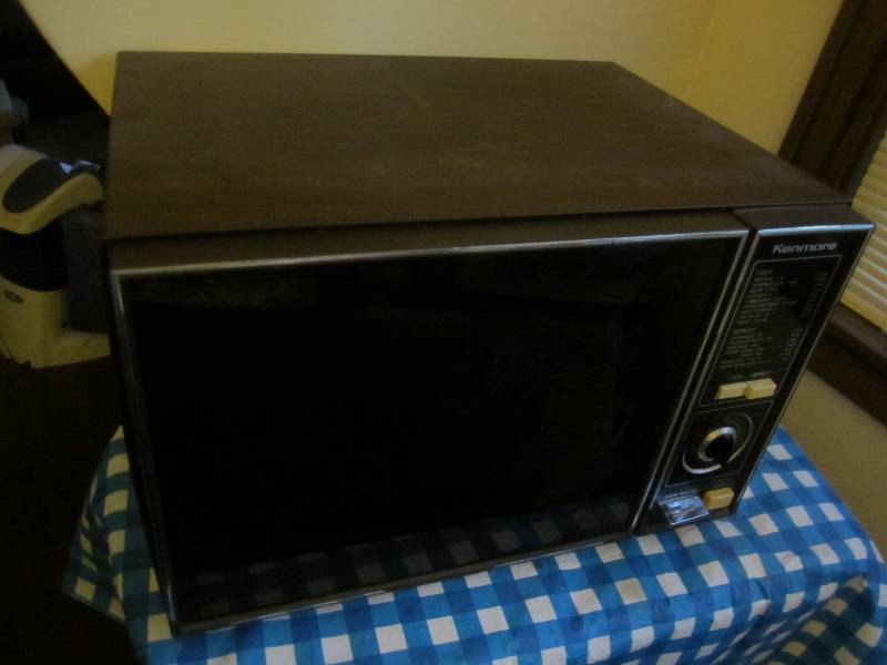 lot 96 image: Kenmore microwave oven, needs clean...