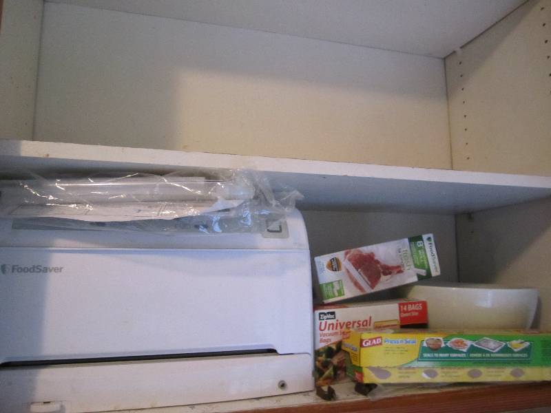 lot 497 image: Food Saver vacuum sealer and storag...