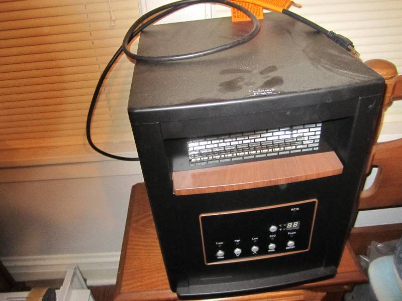 lot 557 image: Source green heat space heater...