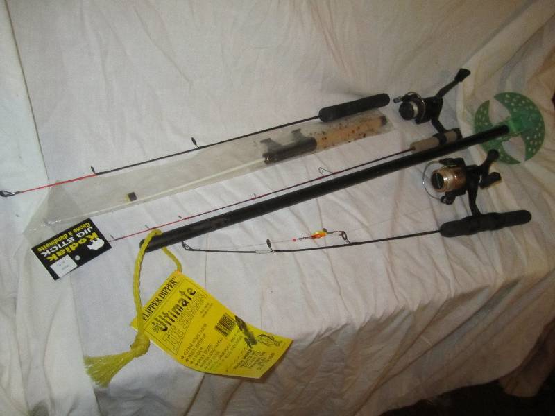 lot 599 image: Ice fishing poles and hole skimmer...