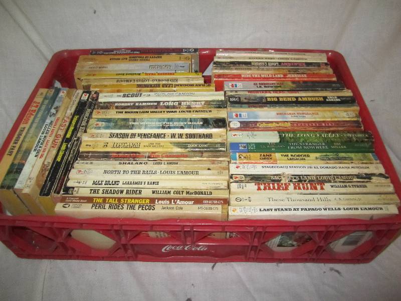 lot 657 image: Coca Cola bin of Western books...