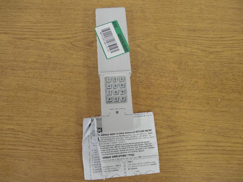 lot 61 image: UNIVERSAL GARAGE DOOR REMOTE ENTRY CLICKER