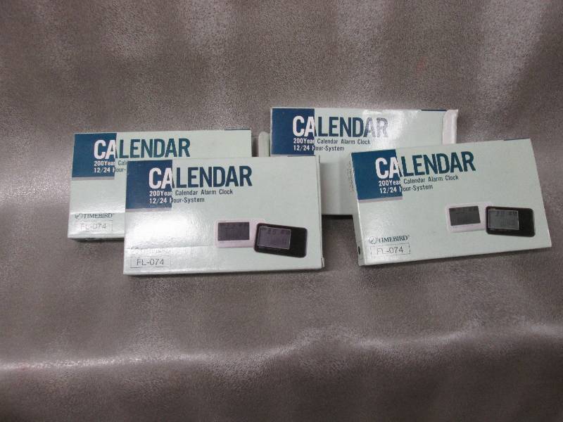 Lot of 4 calendar alarm clocks...
