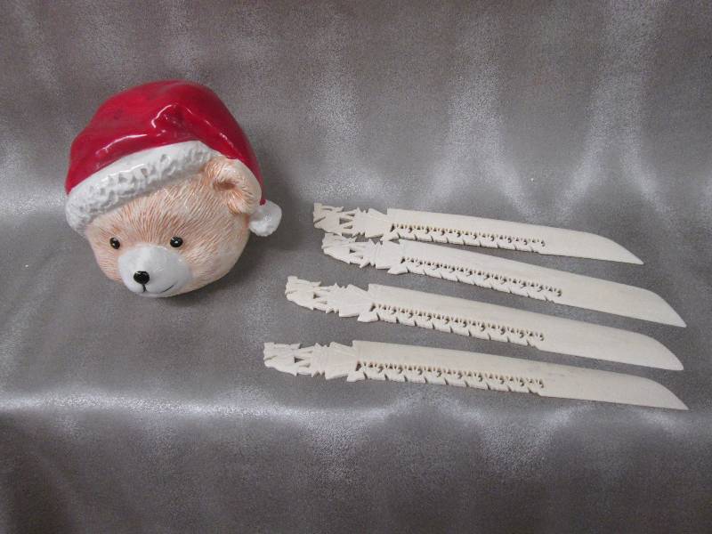Santa bear figurine, 4 letter opene...