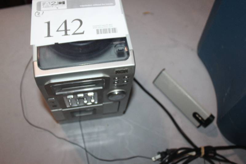 lot 142 image: Lot of (2) Electronics Including 1) RCA Stereo AND 1) Philips Speaker
