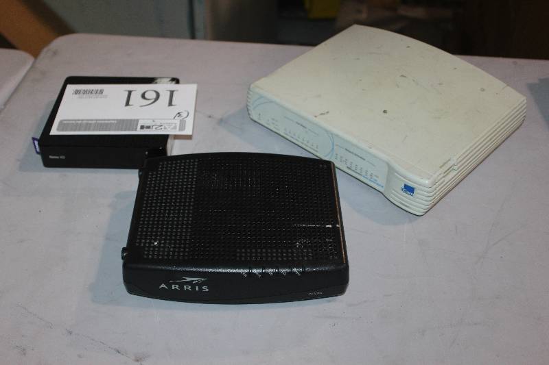 lot 161 image: Lot of (3) Electronics Including 1) Arris Modem AND 1) 3Com OfficeConnect Dual Speed Hub AND 1) Roku XD