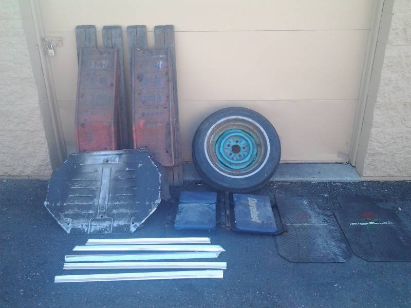 lot 12 image: Pair Of Car Ramps & Random Rat-Rod Car Trims, Tire & Rim, Pair Of Harley Davidson Rubber Car Mats