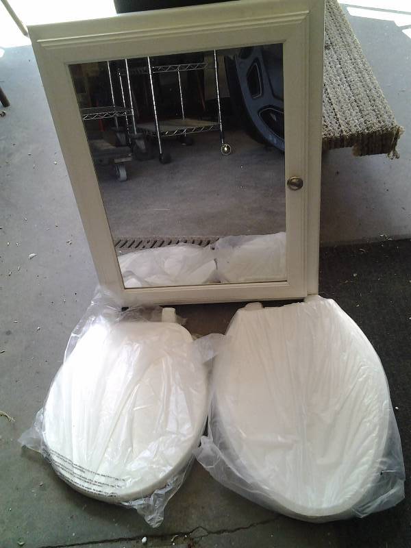 lot 73 image: 2-Toilet Seats, Wall Mount Medicine Cabinet With Mirror, Eureka Vac Bags