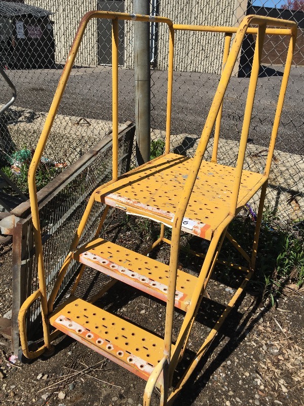 Rolling safety warehouse ladder