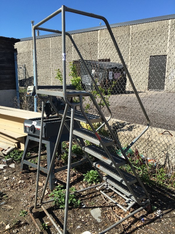 Rolling safety warehouse ladder