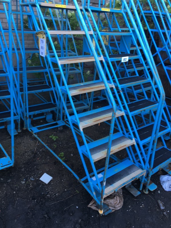 Rolling safety warehouse ladder