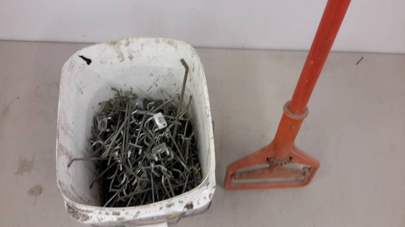 lot 43 image: Bucket of peg hooks and mop handle