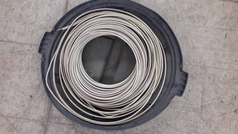 lot 58 image: Roll of household wire and spare can lid