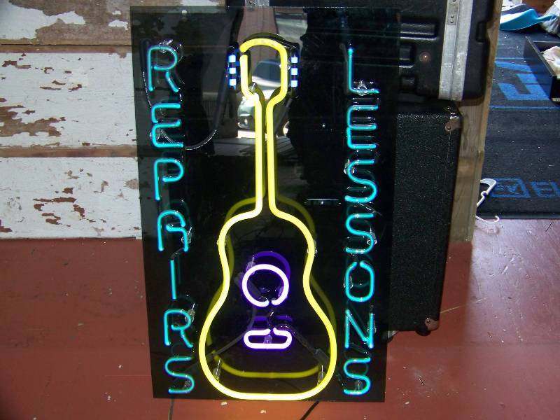 Neon, Guitar Lessons  Repair Sign