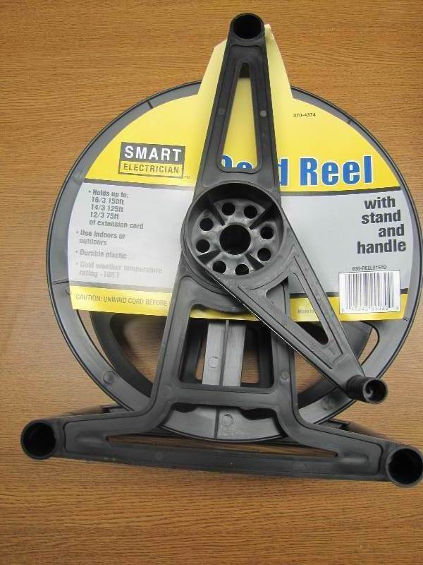 lot 22 image: 2 Garden hoses & New Cord Reel