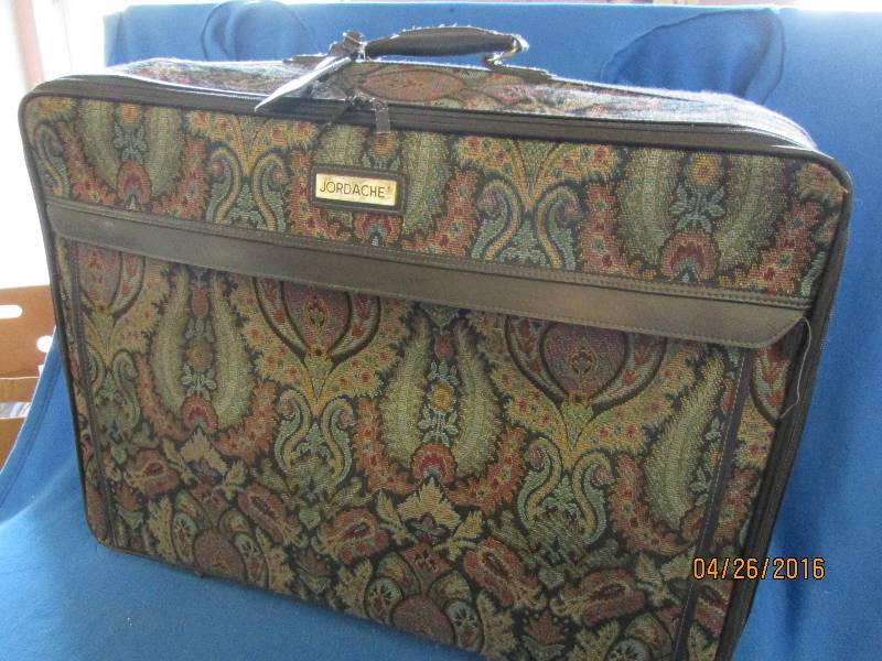 Large Jordache suitcase. Shows mini...