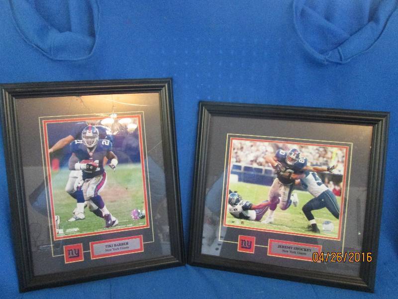 Two framed collector sports figures...
