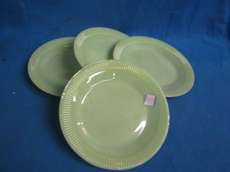 4 green kitchen plates...