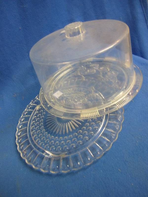 2 glass platters with plastic lid...