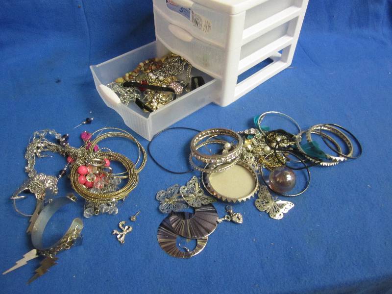 Small container of jewelry...