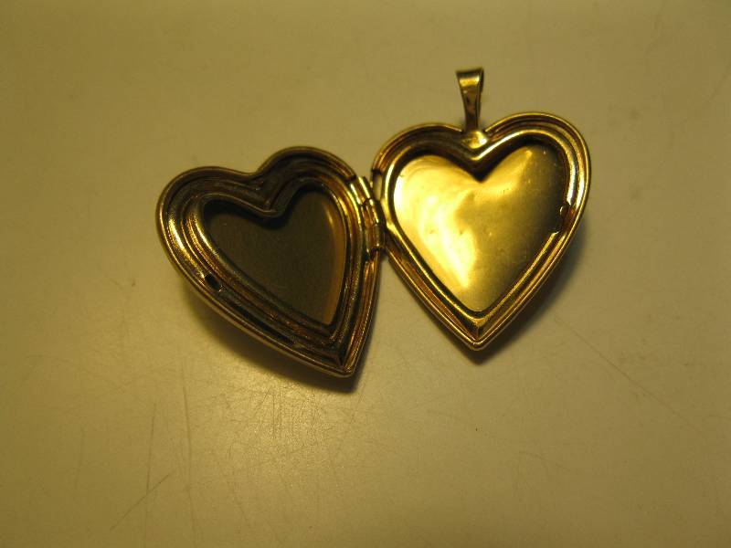 lot 176 image: Gold heart shaped locket