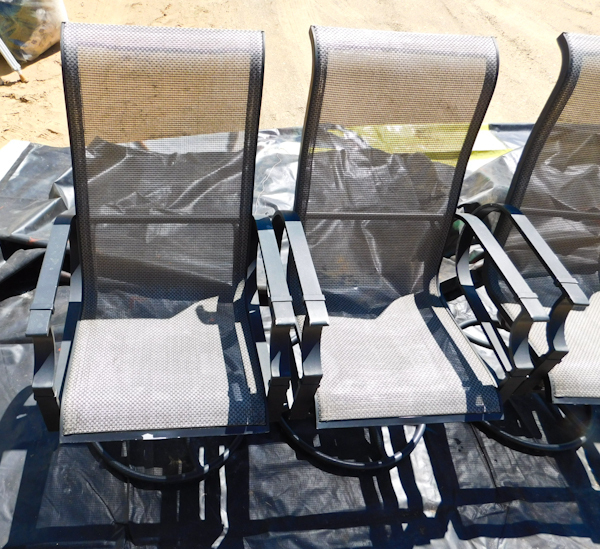 4 deck patio chairs they rock  the fabric is intact some wear