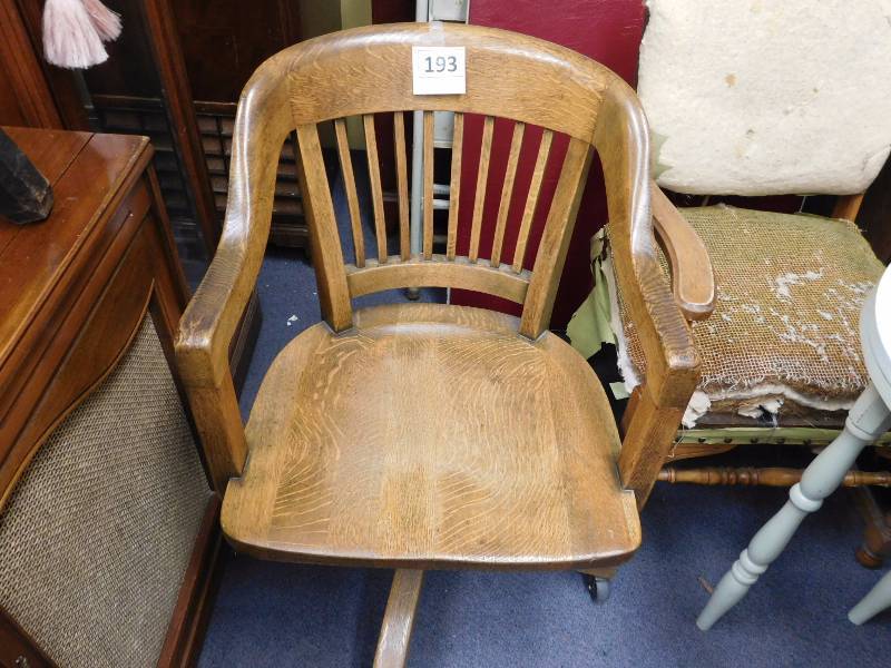 headboard, pressed back chair, vintage wooden office chair and bookshelf