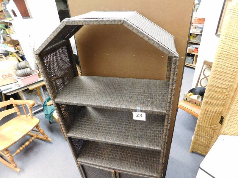 Brown wicker cane woven shelving unit