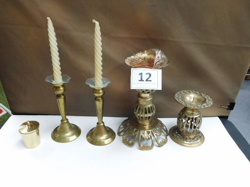 several brass candle holders